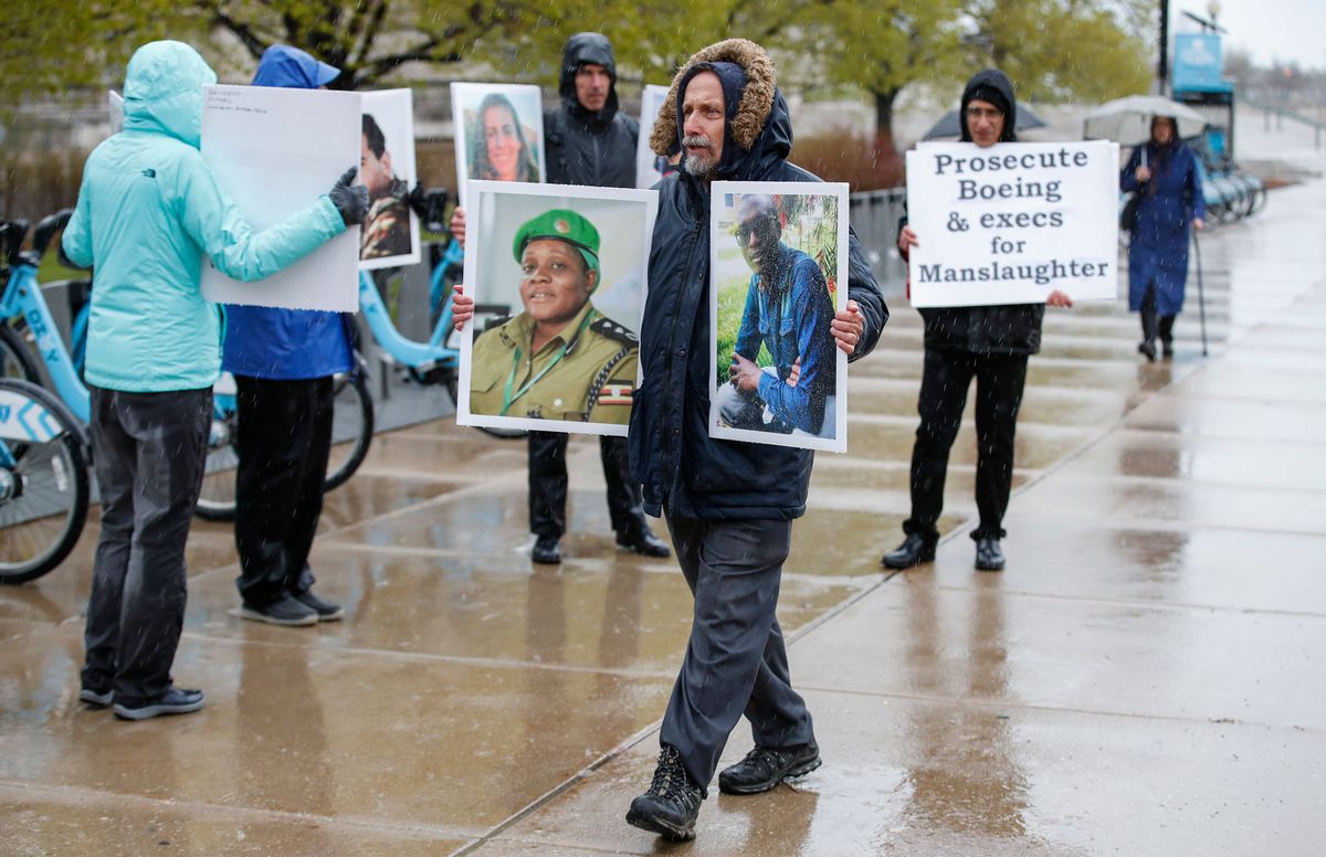 Family and friends of the Ethiopian Airlines Flight 302 Boeing plane crash victims hold a silent protest outside Boeing’s annual shareholders meeting at the Field Museum on April 29, 2019 in Chicago, Illinois. – US regulators considered grounding some Boe