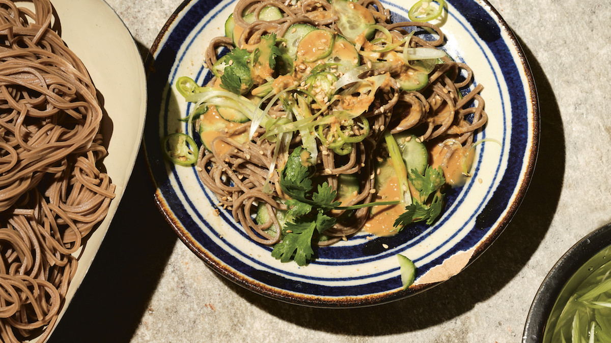 A big plate of cold soba noodles with lemony peanut sauce and crunchy vegetables.