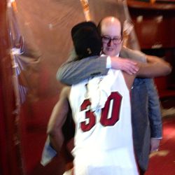 Norris Cole hugs senior VP, assistant GM Andy Ellisburg