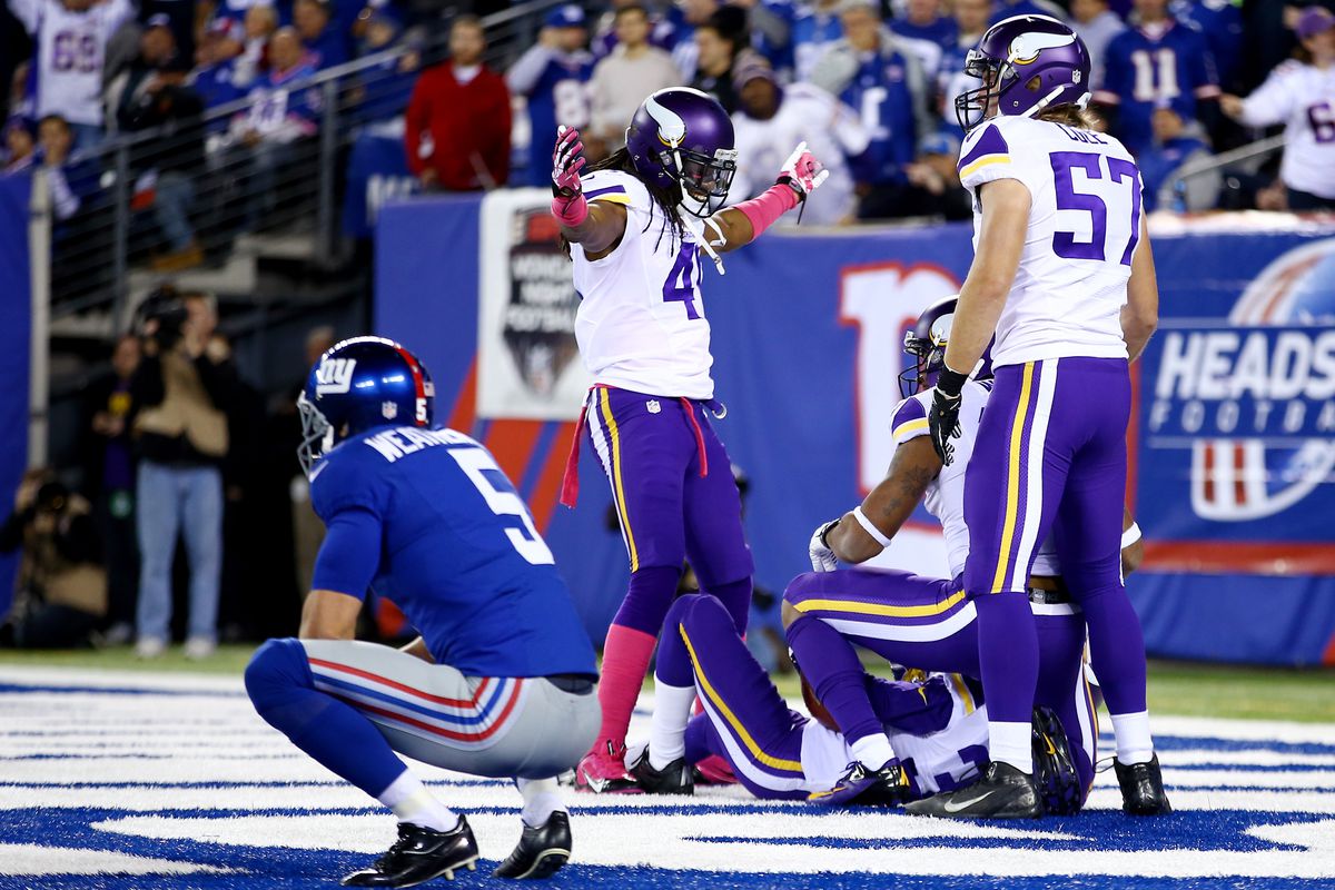 The Vikings celebrate a punt return for a touchdown Monday night.
