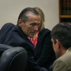 Martin MacNeill greets his defense team as he enters the courtroom after the jury reached a verdict. MacNeill was found guilty of murder and obstruction of justice early Saturday, Nov. 9, 2013.