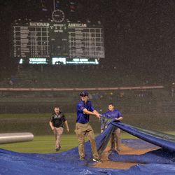 Still struggling with the tarp at 8:46, about four minutes after the delay was called