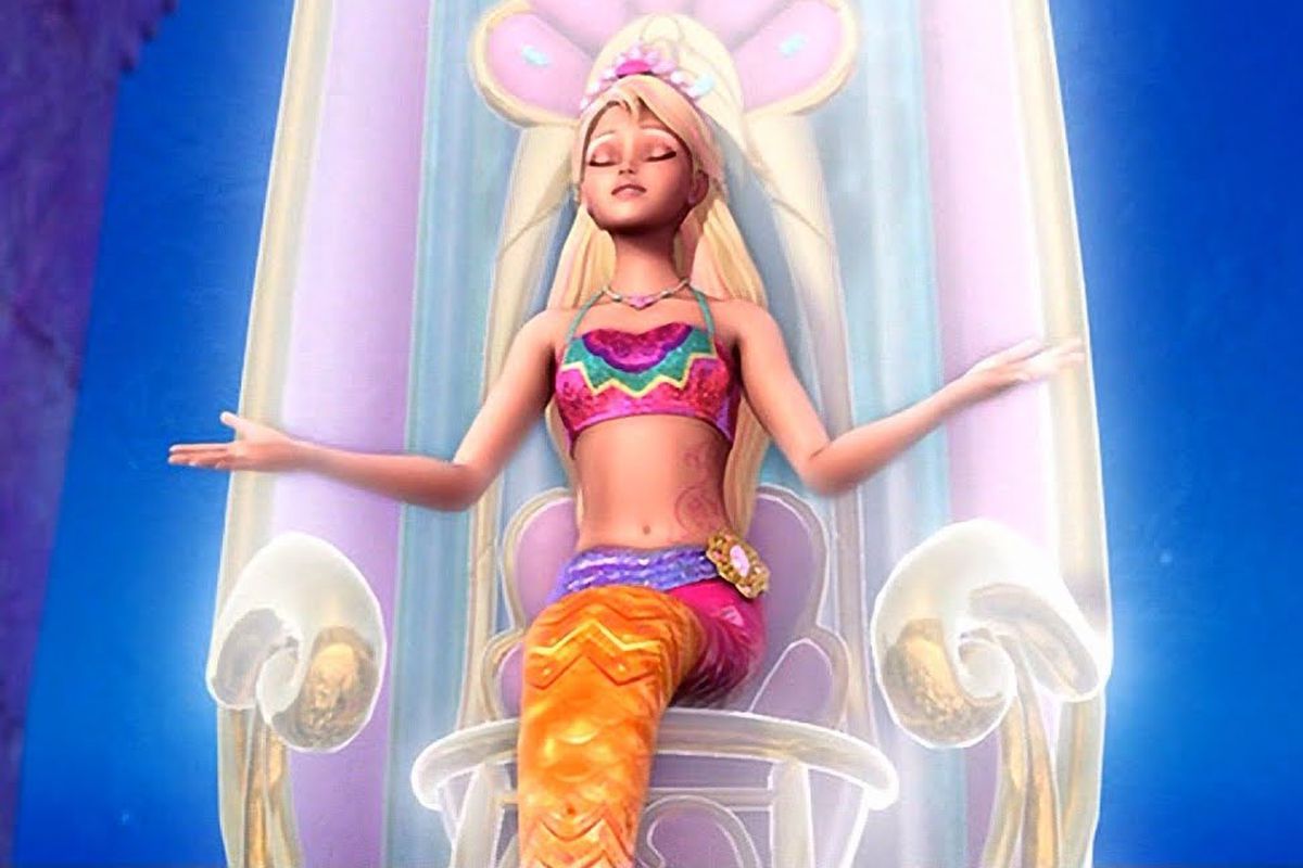 An image of Barbie as a mermaid with a pink tail, sitting on an underwater throne.