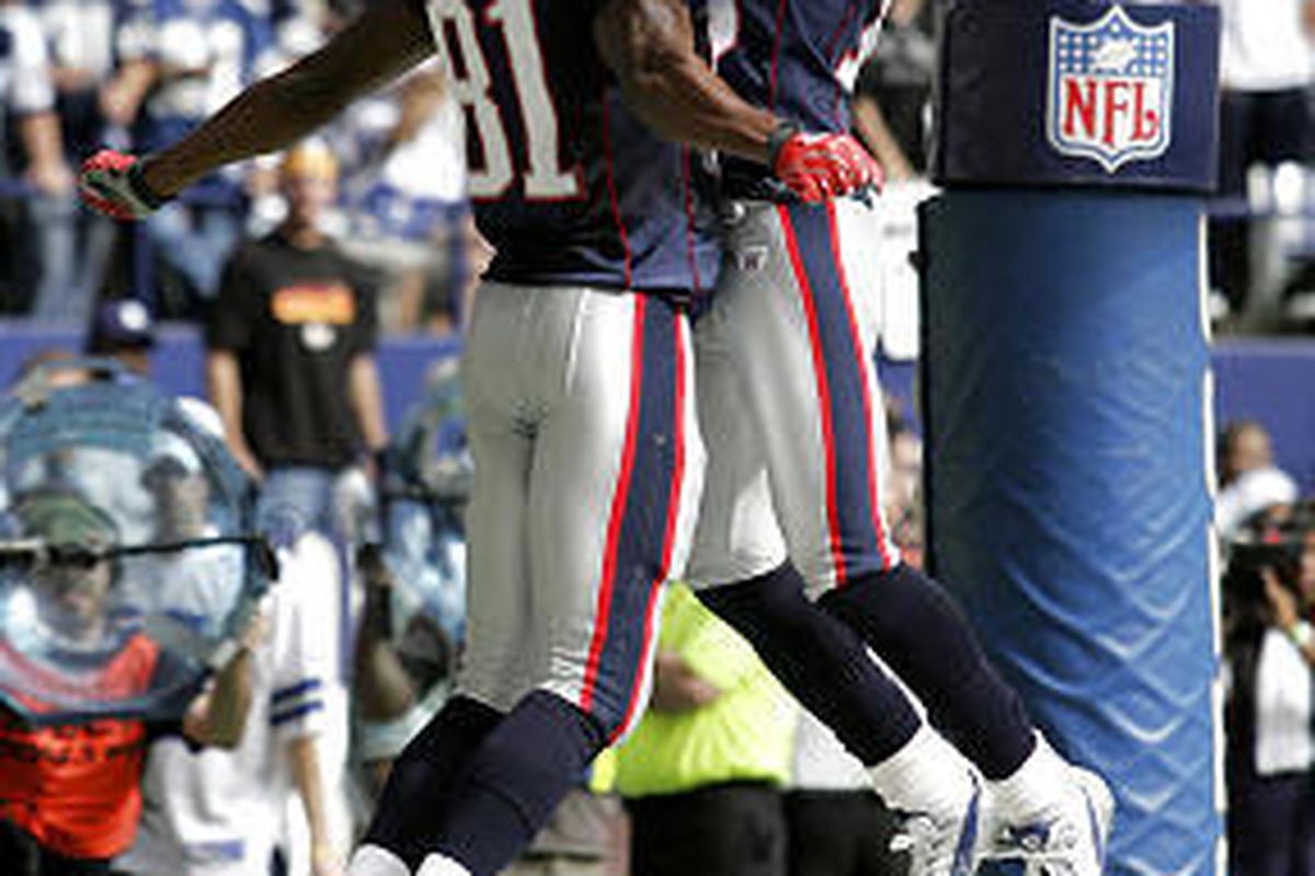 New England receivers Randy Moss (81) and Donte Stallworth celebrate a touchdown.