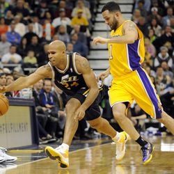 Utah Jazz small forward Richard Jefferson (24) is fouled by Los Angeles Lakers point guard Jordan Farmar (1) while trying to chase down the ball during a game at EnergySolutions Arena on Friday, Dec. 27, 2013.