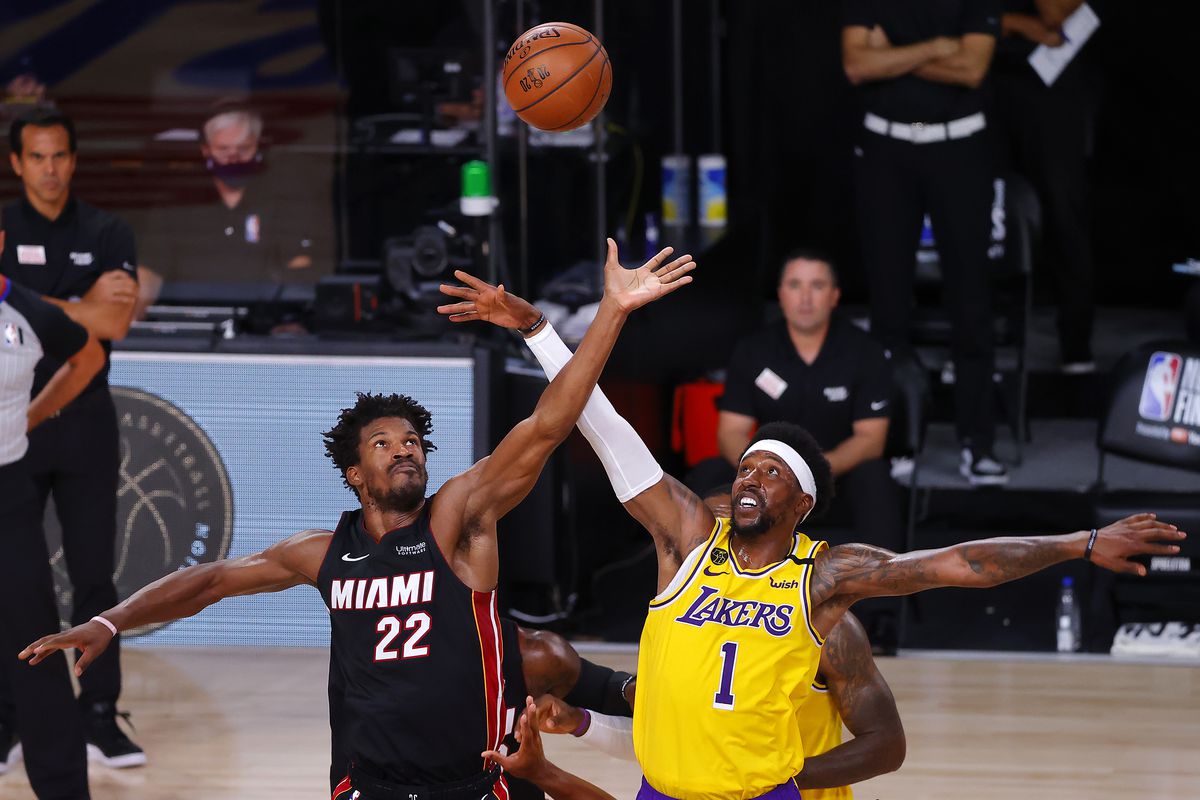 Jimmy Butler of the Miami Heat and Kentavious Caldwell-Pope of the Los Angeles Lakers fight for possession during the second quarter in Game One of the 2020 NBA Finals at AdventHealth Arena at the ESPN Wide World Of Sports Complex on September 30, 2020 in Lake Buena Vista, Florida.&nbsp;