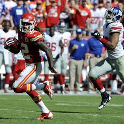 Kansas City Chiefs wide receiver Dexter McCluster (22) returns a punt for a touchdown past New York Giants linebacker Spencer Paysinger (52) in the second half at Arrowhead Stadium. Kansas City won the game 31-7