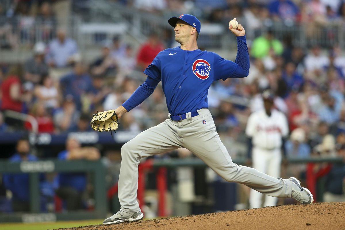 Drew Smyly throws a pitch in the solid blue cubs jerseys