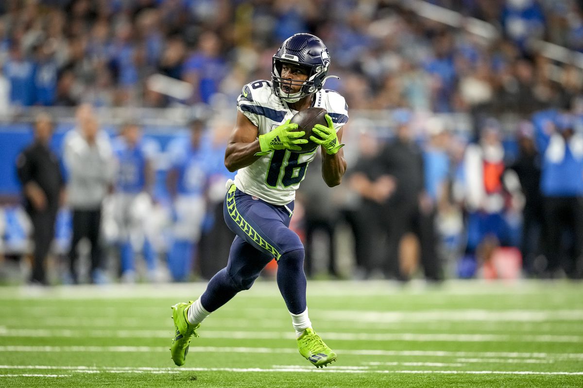 Tyler Lockett #16 of the Seattle Seahawks runs the ball against the Detroit Lions at Ford Field on October 2, 2022 in Detroit, Michigan.