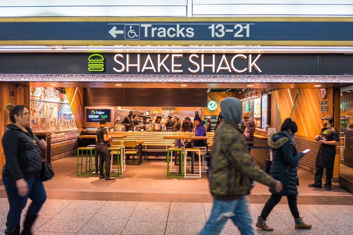 A view of Shake Shack in Penn Station as commuters rush by