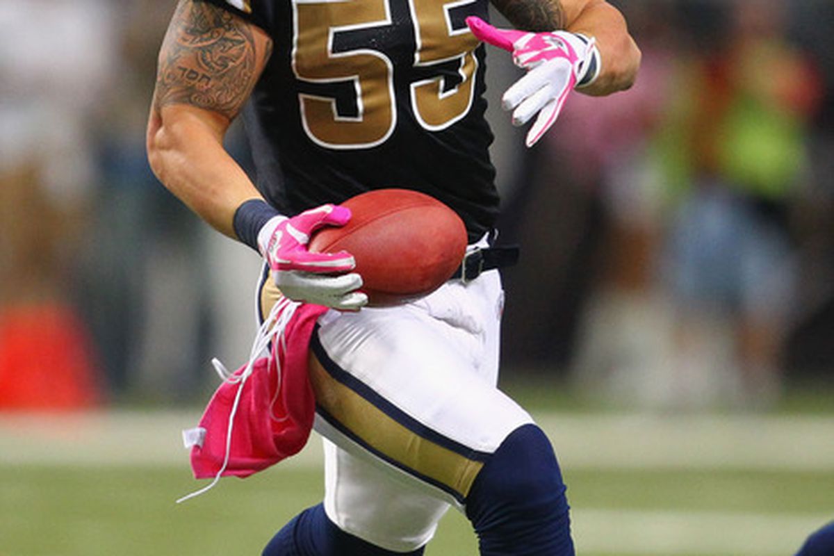 James Laurinaitis #55 of the St. Louis Rams returns an interception against the Washington Redskins at the Edward Jones Dome on October 2, 2011 in St. Louis, Missouri.  The Redskins beat the Rams 17-10.  (Photo by Dilip Vishwanat/Getty Images)