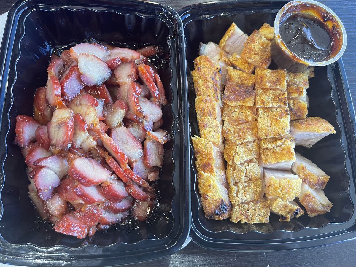 Chung Wang BBQ’s char siu and crispy pork in two to-go boxes.