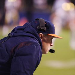 Virginia Cavalier coach Bronco Mendenhall watches a play during a game with Notre Dame in Charlottesville, Va., on Thursday Nov 13, 2021. Mendenhall is stepping down as coach.