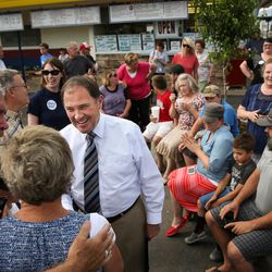 Greg Haws, left, and his wife, Debi Haws, daughter of Burger Bar founder Ben Fowler, chat with Gov. Gary Herbert during an event at the restaurant in Roy on Tuesday, June 7, 2016. Herbert visited Burger Bar to read a proclamation honoring Fowler, who recently died at 96, and to campaign for re-election.