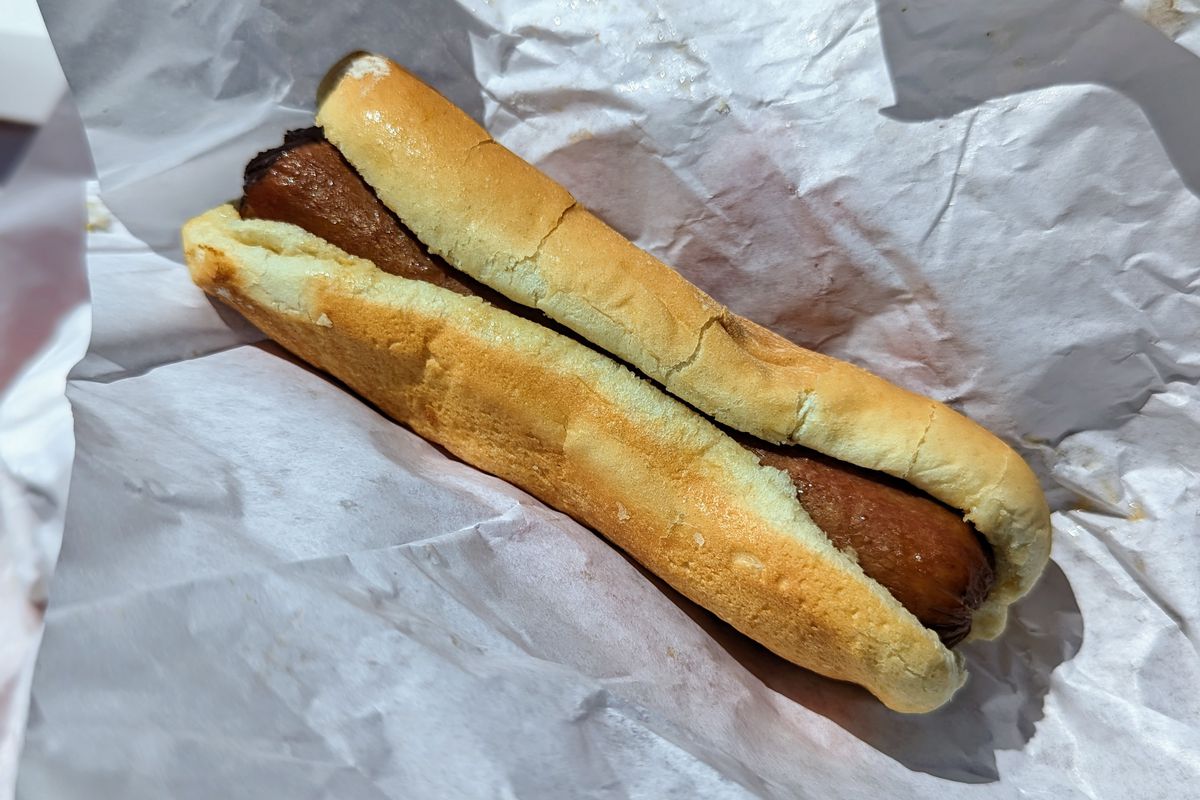 A Nathan’s all-beef hot dog at the Food Spot wrapped in paper.