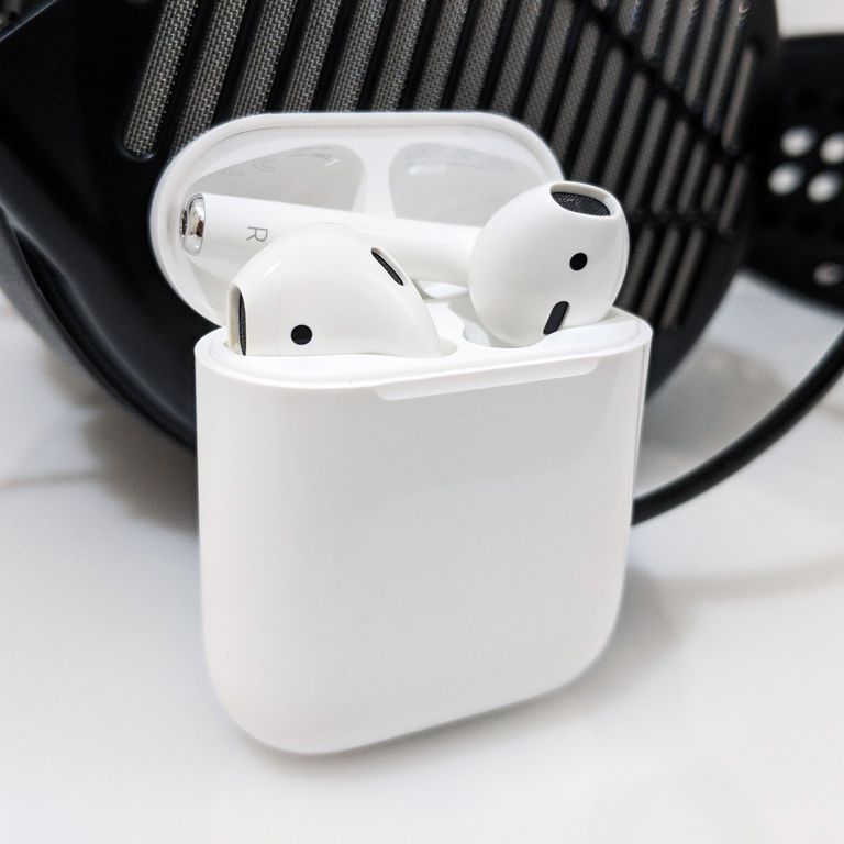 Apple AirPods in front of an Audeze MX4