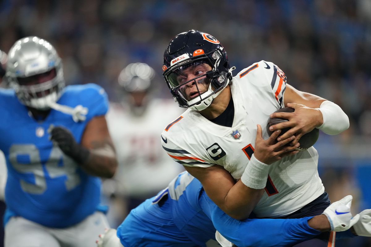 Justin Fields #1 of the Chicago Bears is sacked during the third quarter in the game against the Detroit Lions at Ford Field on January 01, 2023 in Detroit, Michigan.
