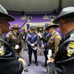 Ohio State Highway Patrol trooper Hector Burgos, left, and Lt. Mike Combs gather for funeral services for Utah Highway Patrol trooper Eric Ellsworth at the Dee Events Center in Ogden on Wednesday, Nov. 30, 2016.