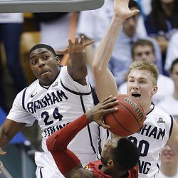 BYU's Frank Bartley IV and teammate Eric Mika try to defend DeAndre Kane as BYU and Iowa State play Wednesday, Nov. 20, 2013, in the Marriott Center in Provo. Iowa State won 90-88.