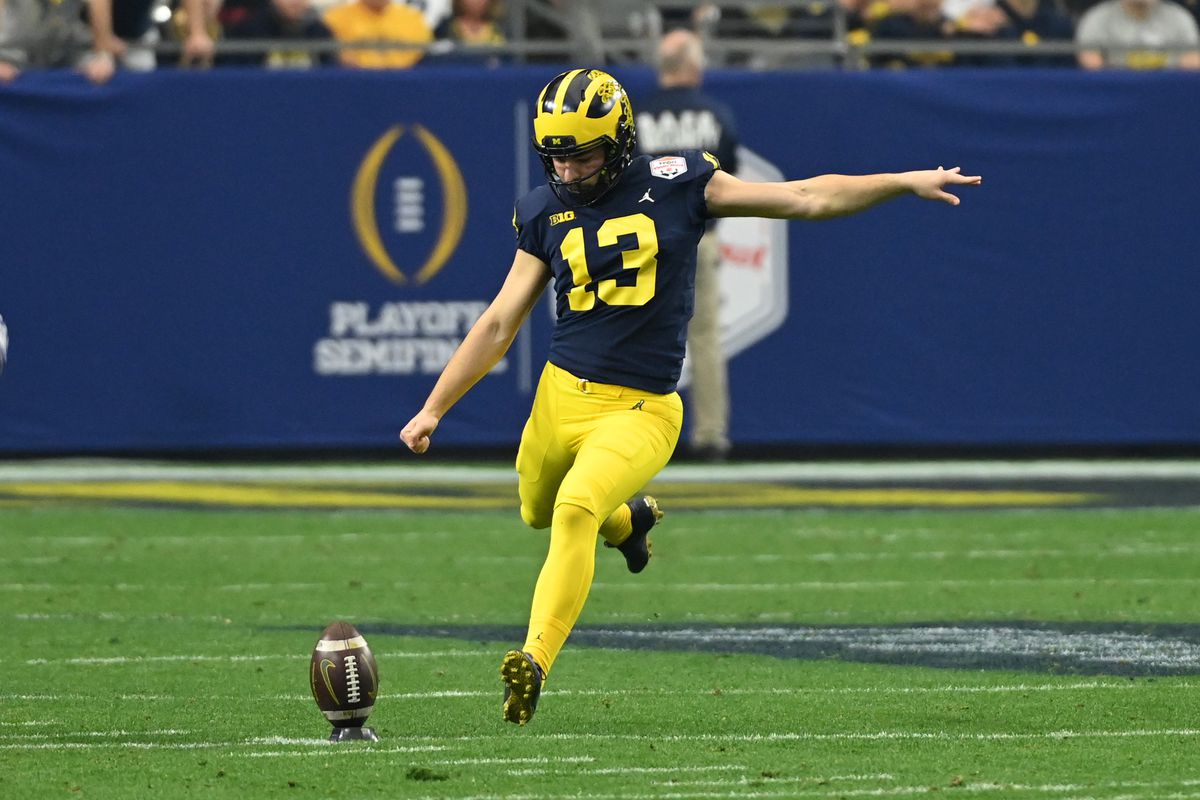 GLENDALE, ARIZONA - DECEMBER 31: Jake Moody #13 of the Michigan Wolverines kicks the ball off against the TCU Horned Frogs during the Vrbo Fiesta Bowl at State Farm Stadium on December 31, 2022 in Glendale, Arizona.