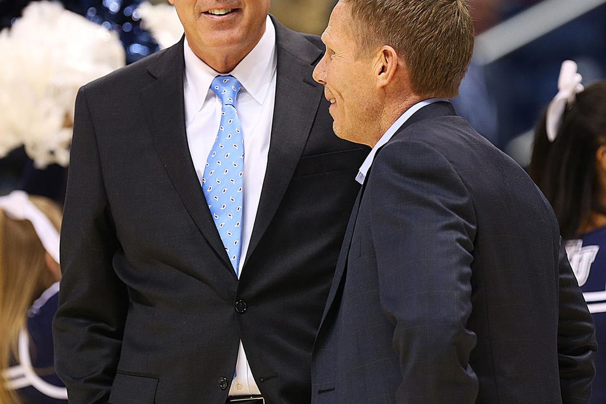 Brigham Young Cougars head coach Dave Rose and Gonzaga Bulldogs head coach Mark Few talk prior to tipoff as BYU and Gonzaga play in an NCAA basketball game in the Marriott Center in Provo on Saturday, Feb. 24, 2018. 