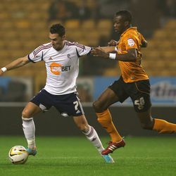 WOLVERHAMPTON, ENGLAND - OCTOBER 23: Chris Eagles of Bolton is challenged by Tongo Doumbia during the npower Championship match between Wolverhampton Wanderers and Bolton Wanderers at Molineux on October 23, 2012 in Wolverhampton, England. (Photo by David