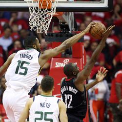 Utah Jazz forward Derrick Favors (15) blocks a shot by Houston Rockets forward Luc Mbah a Moute (12) as the Utah Jazz and the Houston Rockets play game two of the NBA playoffs at the Toyota Center in Houston on Wednesday, May 2, 2018.