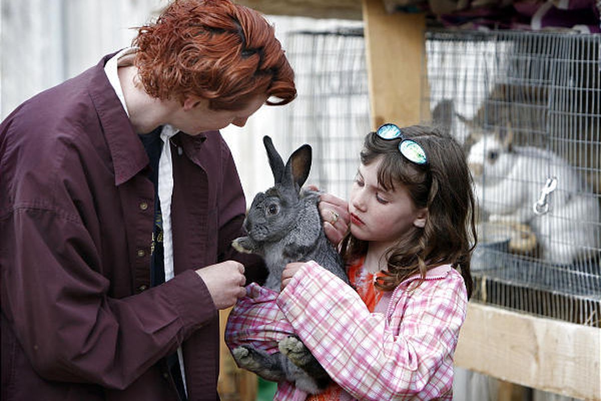 Shayna Page and daughter Casidey care for a rabbit that was attacked by a mink.     