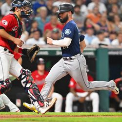 CLEVELAND, OHIO - SEPTEMBER 03: Jesse Winker #27 of the Seattle Mariners scores during the fifth inning against the Cleveland Guardians at Progressive Field on September 03, 2022 in Cleveland, Ohio.