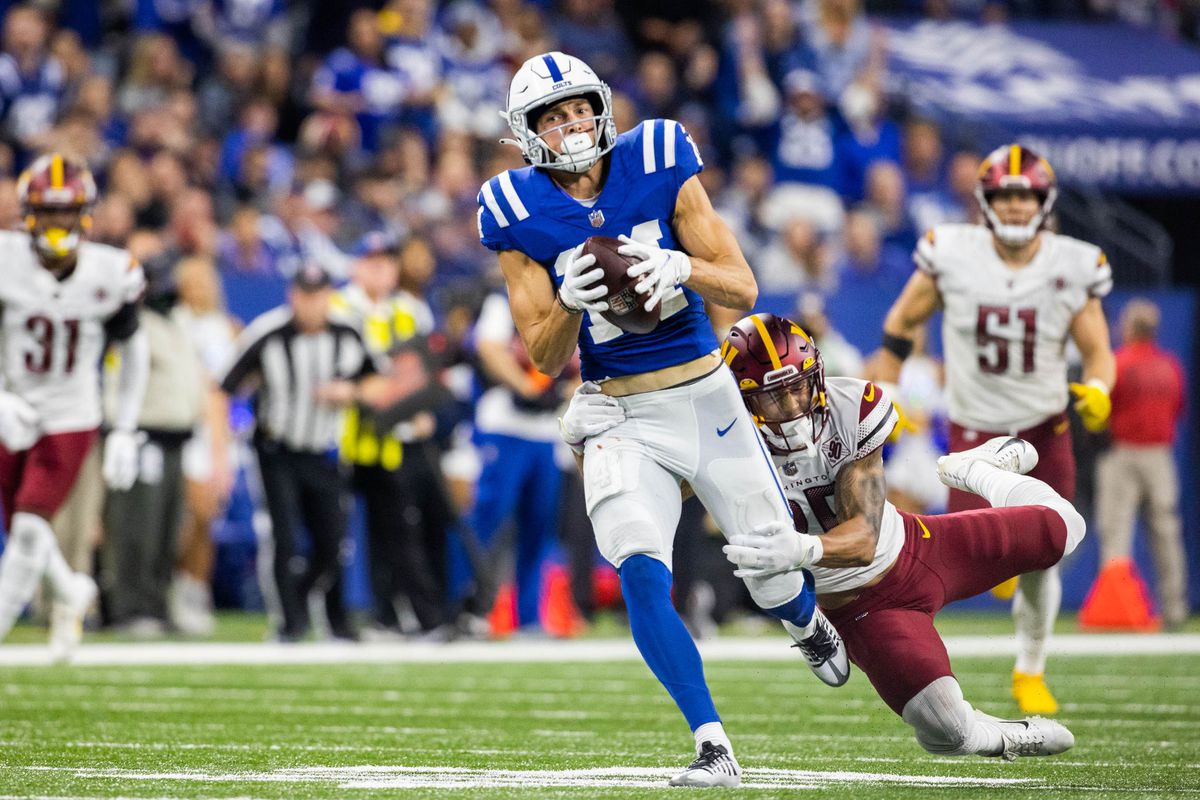 ndianapolis Colts wide receiver Alec Pierce (14) catches the ball while Washington Commanders cornerback Benjamin St-Juste (25) defends in the second half at Lucas Oil Stadium.&nbsp;