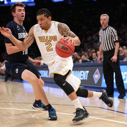Brigham Young Cougars guard Zac Seljaas (2) tries to stay with Valparaiso Crusaders guard Tevonn Walker (2) as BYU and Valparaiso play in NIT semifinal action at Madison Square Garden in New York City. BYU loses 70-72 Tuesday, March 29, 2016.