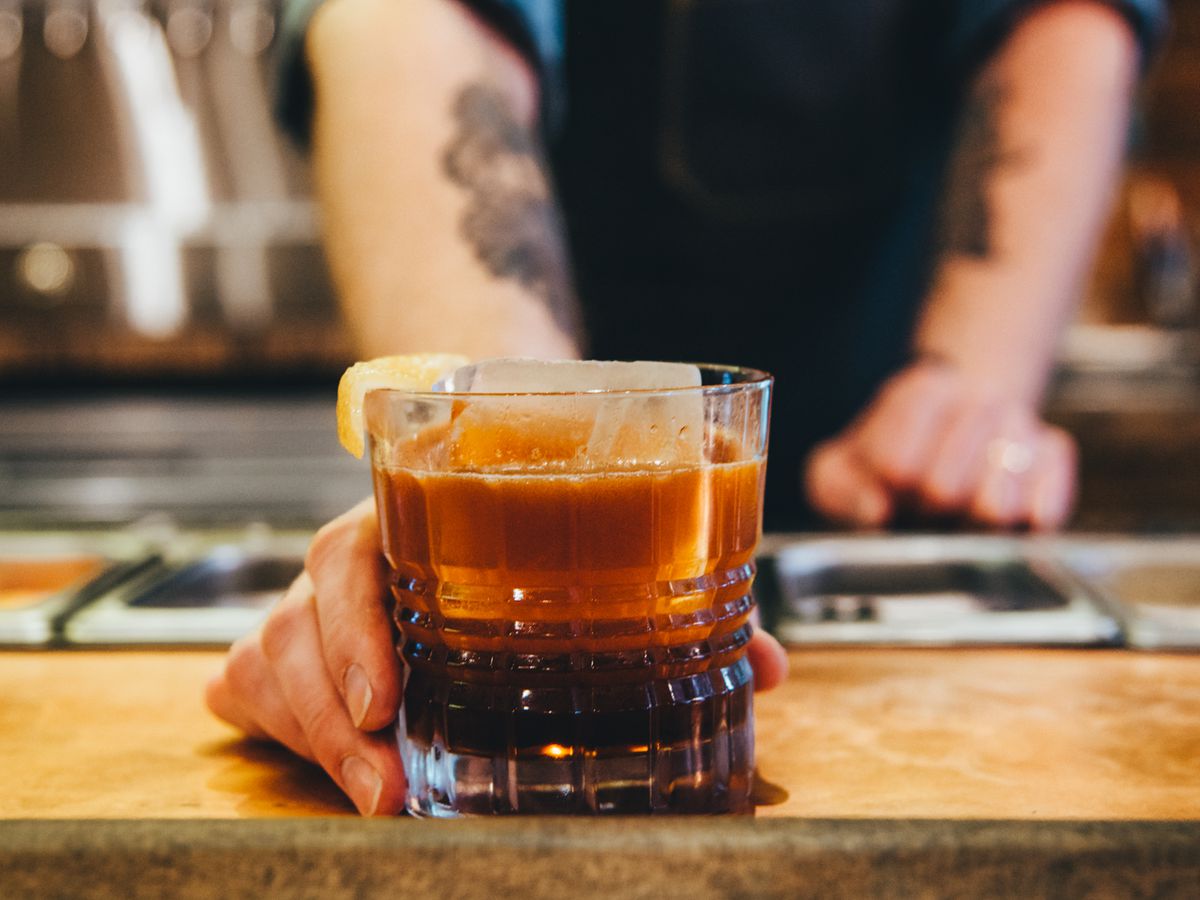 A nitrogen-infused peanut bourbon and cola at the playful new Brass Tacks