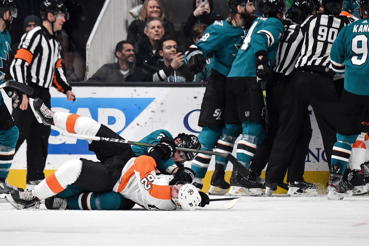 Timo Meier #28 of the San Jose Sharks fights on the ice against Nicolas Aube-Kubel #62 of the Philadelphia Flyers at SAP Center on December 28, 2019 in San Jose, California.