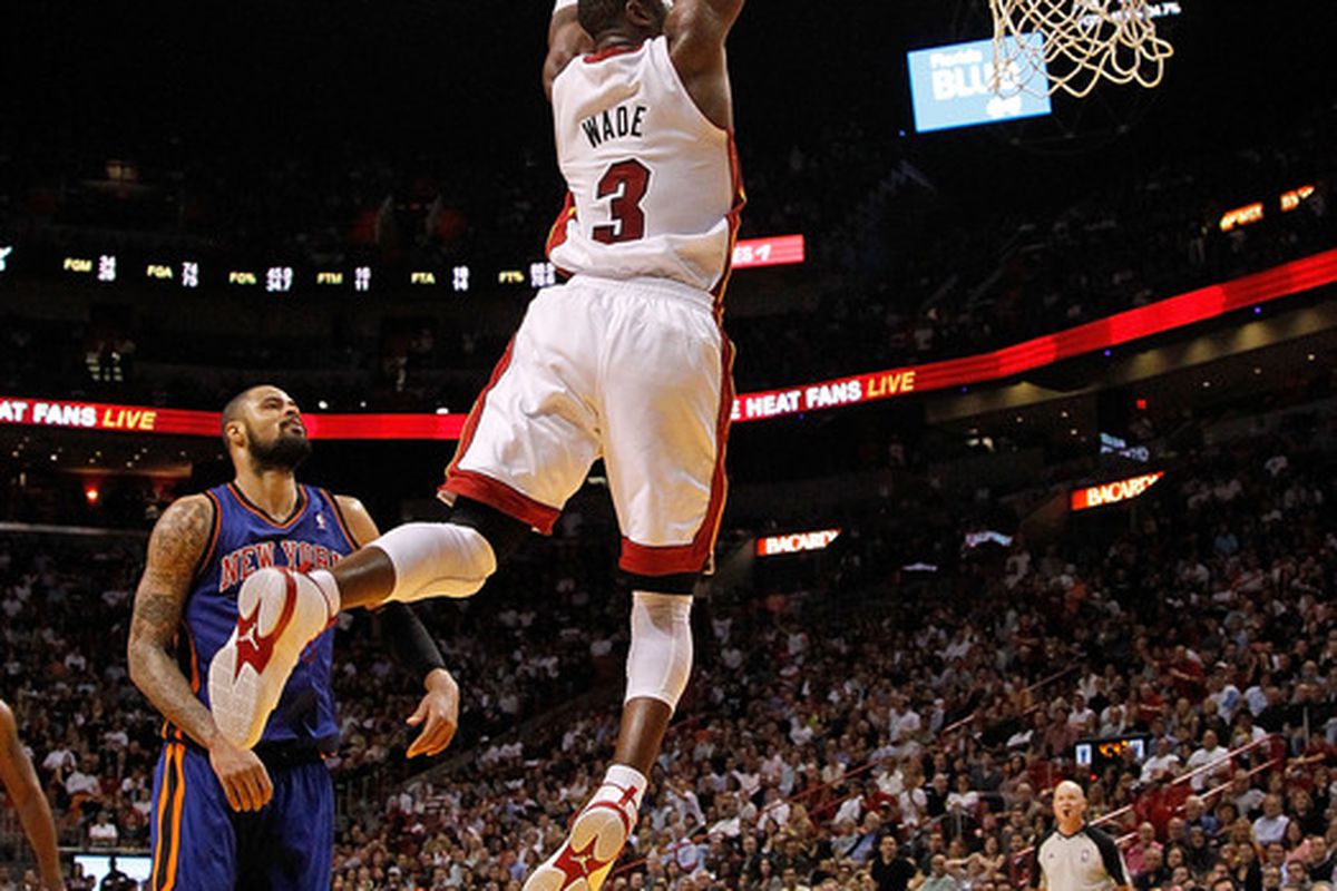 MIAMI, FL - JANUARY 27: Dwyane Wade of the Miami Heat dunks past Tyson Chandler #6 of the New York Knicks during a game at American Airlines Arena. (Photo by Mike Ehrmann/Getty Images)