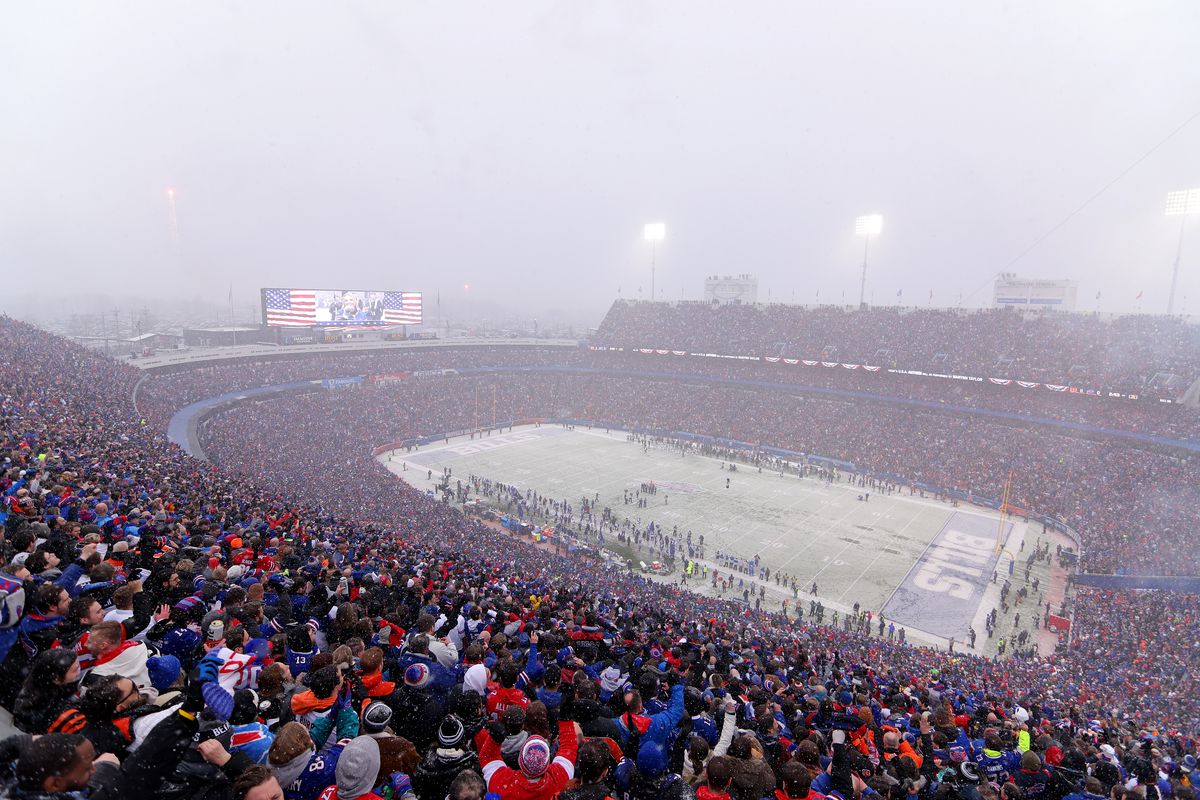 Fans cheer as snow falls during the first half in the AFC Divisional Playoff game between the Cincinnati Bengals and the Buffalo Bills at Highmark Stadium on January 22, 2023 in Orchard Park, New York.