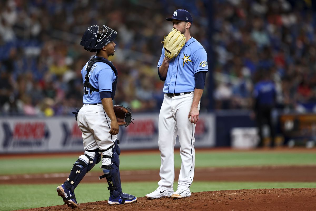 Jeffrey Springs of the Tampa Bay Rays talks with Francisco Mejia on the mound during the seventh inning against the Oakland Athletics at Tropicana Field on April 08, 2023 in St Petersburg, Florida.