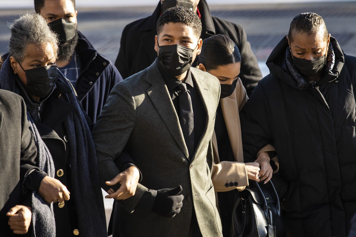 With his mother, Janet Smollett, on his right arm and flanked by other family members and supporters, former “Empire” star Jussie Smollett walks into the Leighton Criminal Courthouse, Tuesday morning, Nov. 30, 2021. The 39-year-old actor and singer is charged with lying to Chicago police in 2019 when he claimed he was the victim of a racist and anti-gay attack near his Streeterville apartment.