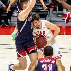 Utah Utes forward Riley Battin (21) moves with the ball during a men’s basketball game at the Huntsman Center in Salt Lake City on Thursday, Feb. 4, 2021.