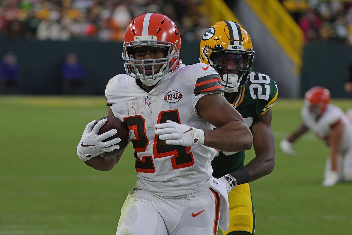 Nick Chubb #24 of the Cleveland Browns runs for yards during a game against the Green Bay Packers at Lambeau Field on December 25, 2021 in Green Bay, Wisconsin. The Packers defeated the Browns 24-22.