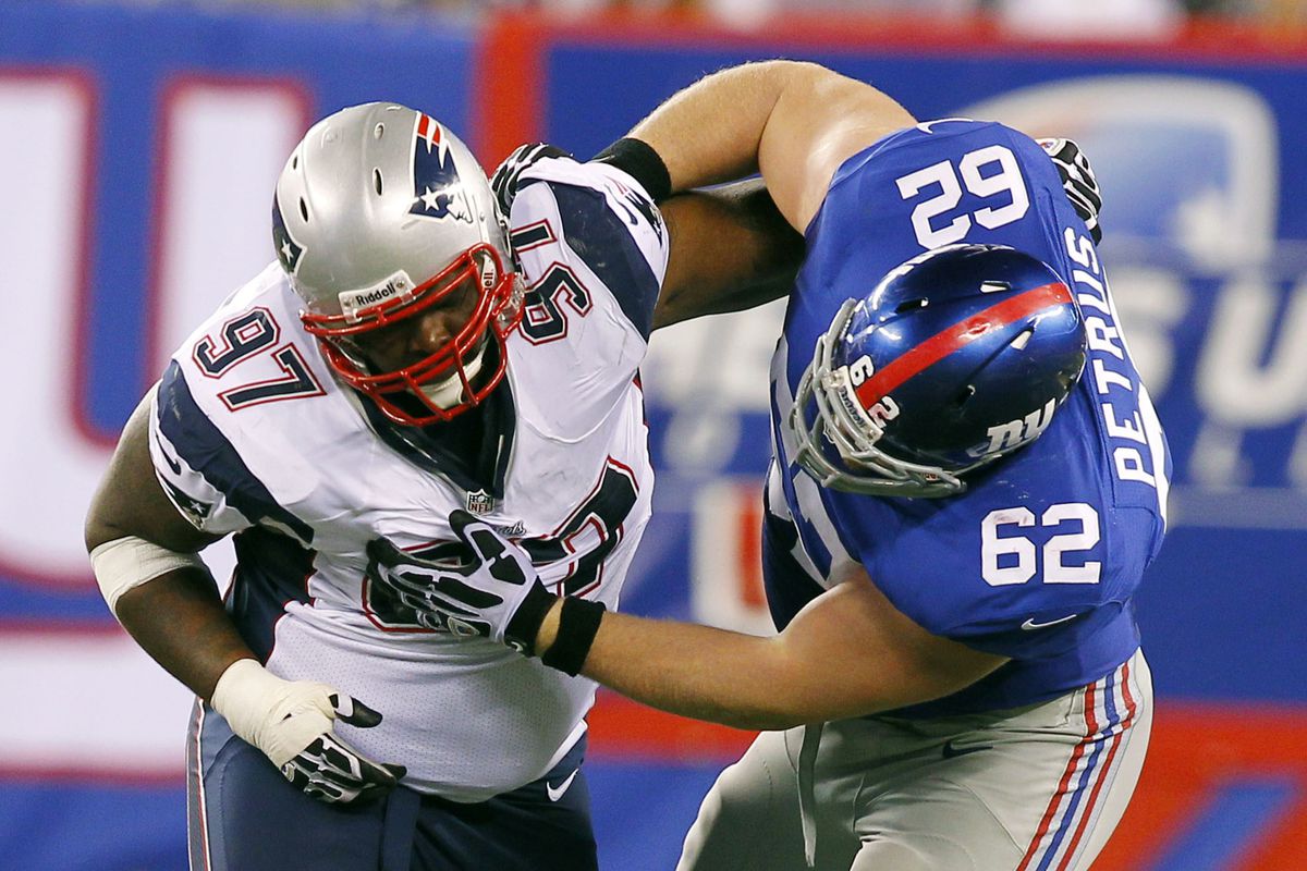 Aug 29, 2012; East Rutherford, NJ, USA;  New England Patriots defensive tackle Ron Brace (97) and New York Giants offensive guard Mitch Petrus (62) during the second half at MetLife Stadium. Jim O'Connor-US PRESSWIRE