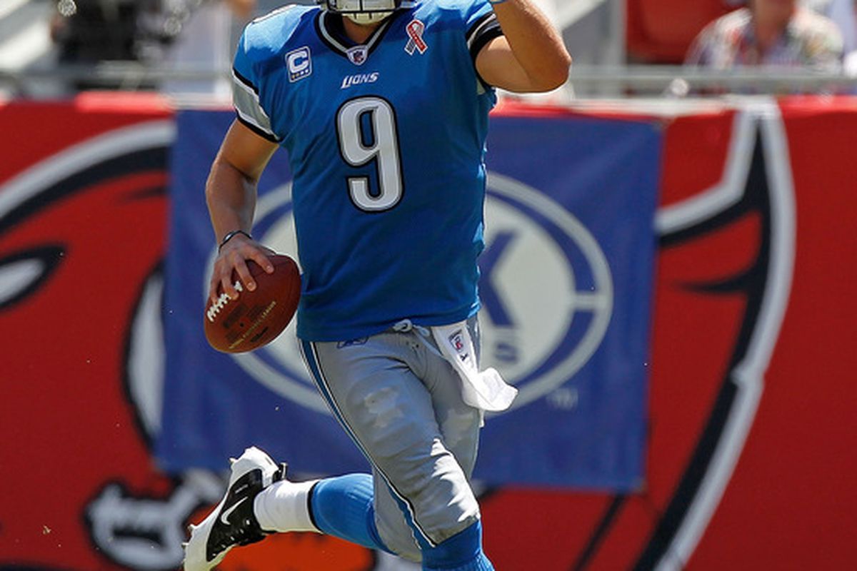 TAMPA, FL - SEPTEMBER 11:  Matthew Stafford #9 of the Detroit Lions scrambles during the season opener against the Tampa Bay Buccaneers at Raymond James Stadium on September 11, 2011 in Tampa, Florida.  (Photo by Mike Ehrmann/Getty Images)