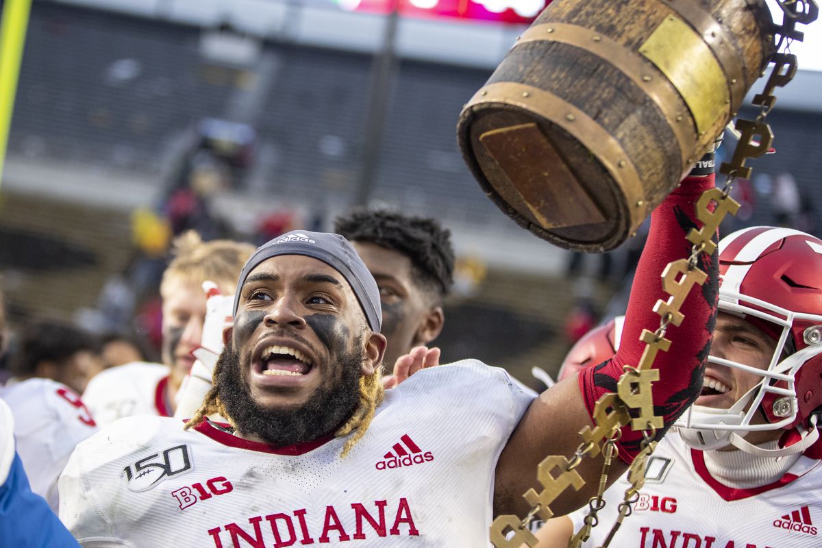 Reakwon Jones of the Indiana Hoosiers holds the Old Oaken Bucket following the double overtime win over the Purdue Boilermakers at Ross-Ade Stadium on November 30, 2019 in West Lafayette, Indiana.