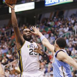 Utah's Al Jefferson puts up a shot over Denver's Javale McGee as the Utah Jazz and the Denver Nuggets play Wednesday, April 3, 2013 in Salt Lake City at EnergySolutions Arena. Denver beat the Jazz 113-96.
