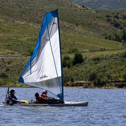 An adaptive sailboat controlled by Derek Sundquist floats on East Canyon Reservoir in East Canyon State Park on Thursday, July 18, 2019. The Tetradapt Initiative offers a variety of adaptive recreation options, including a sailboat that allows quadriplegics to sail.