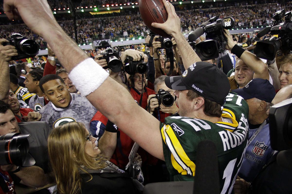Aaron Rodgers, right, holds the Vince Lombardi Trophy alongside teammate Clay Matthews.