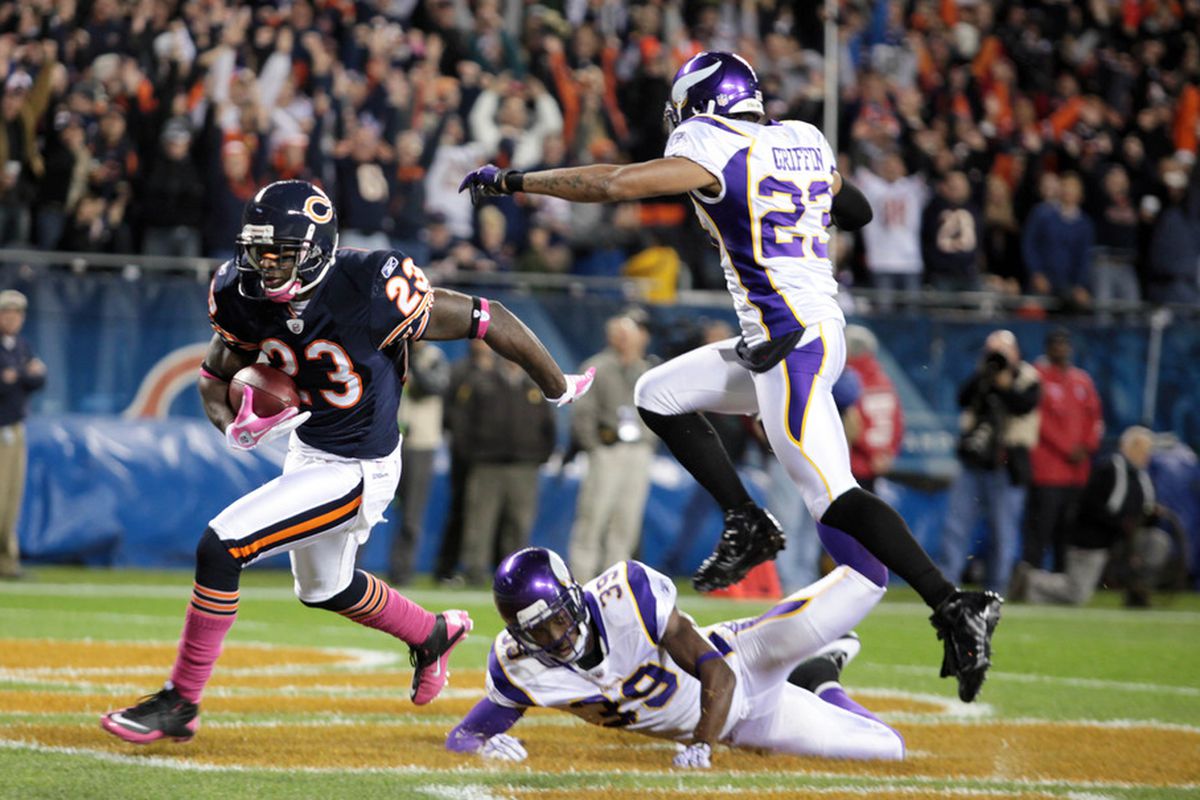 CHICAGO, IL - OCTOBER 16: Devin Hester #23 of the Chicago Bears scores against the Minnesota Vikings Cedric Griffith #23 and Husain Abdullah #39 at Soldier Field on October 16, 2011 in Chicago, Illinois.  (Photo by Tasos Katopodis /Getty Images)