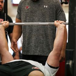 Defensive end Hunter Dimick bench presses at the University of Utah football pro day in Salt Lake City on Thursday, March 23, 2017.