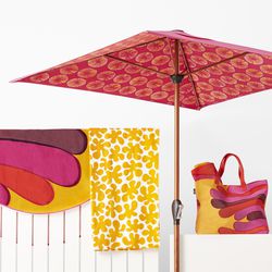 Umbrella, $99.99; Oversized Beach Tote, $19.99; Beach Towel, $24.99