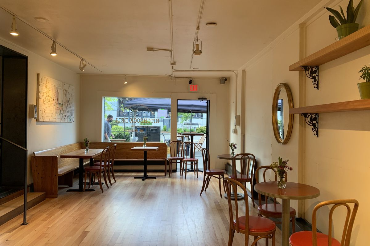 The interior of Cafe Hitchcock on Bainbridge Island, looking out toward the front window, with a small table off to the right