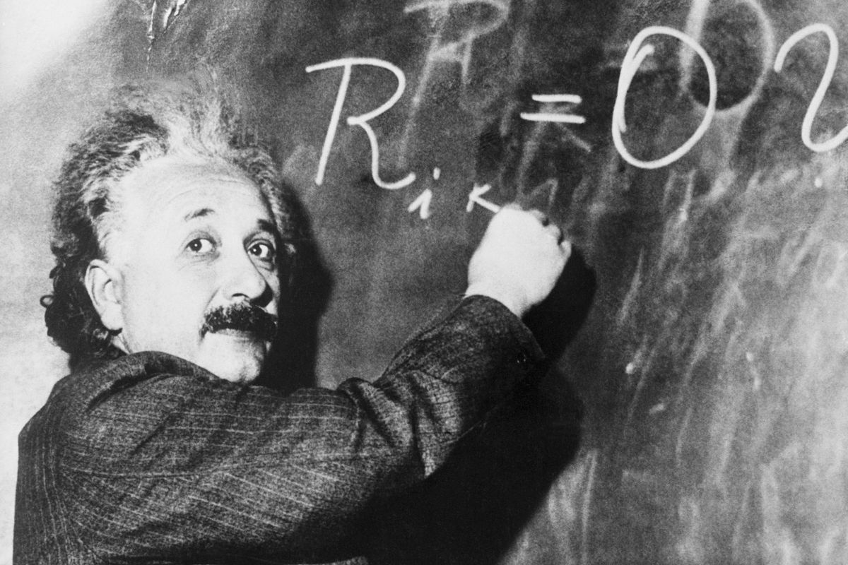 Einstein Writing Equation on Blackboard
